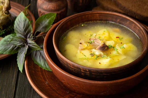 Horseradish soup with wild partridge in a brown vintage bowl. — Stock Image Horseradish soup with wild partridge in a brown vintage bowl. Royalty Free Stock Images