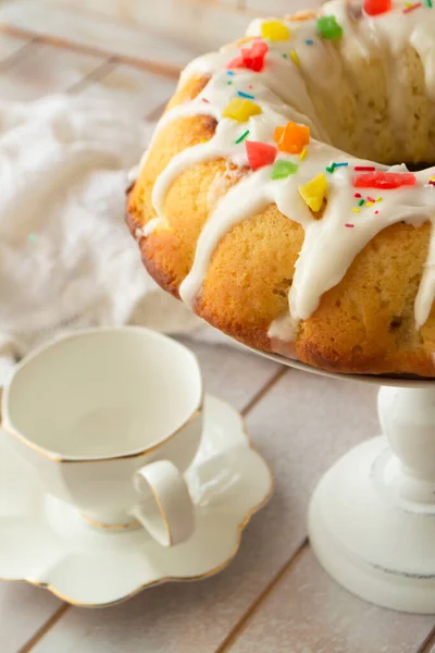 Easter cake, Bundt cake, easter concept, panettone. still life of food in white color, easter day, spring food, brioche. Vertical image