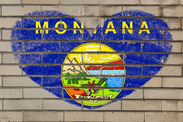 Heart shape flag of montana on brick wall — Stock Photo, Image