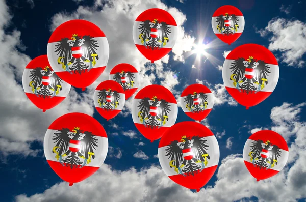 Many balloons with austria flag on sky — Stock Photo, Image