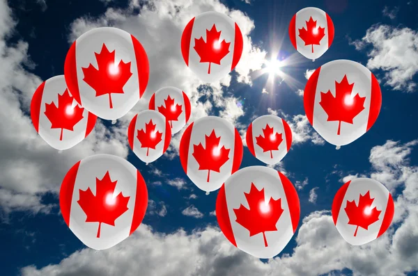 Many balloons with canada flag on sky — Stock Photo, Image