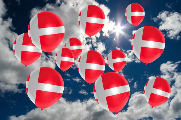 Many balloons with denmark flag on sky — Stock Photo, Image