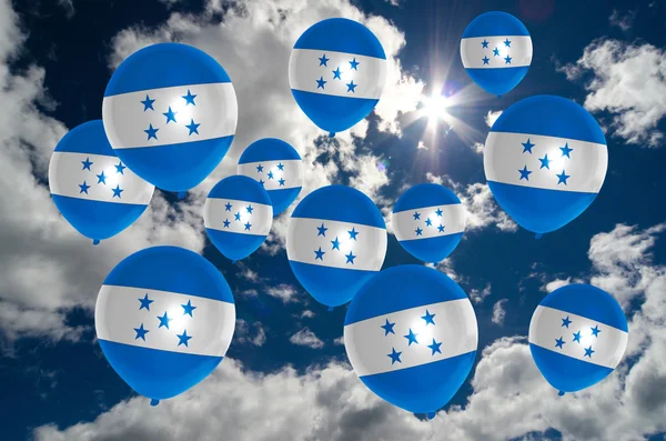 Muchos globos con bandera de honduras en el cielo —  Fotos de Stock