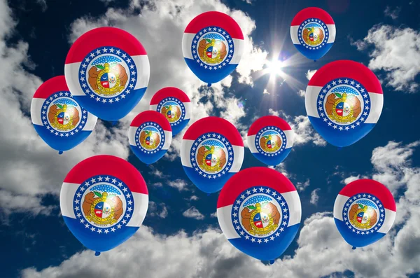 Many balloons with missouri flag on sky — Stock Photo, Image