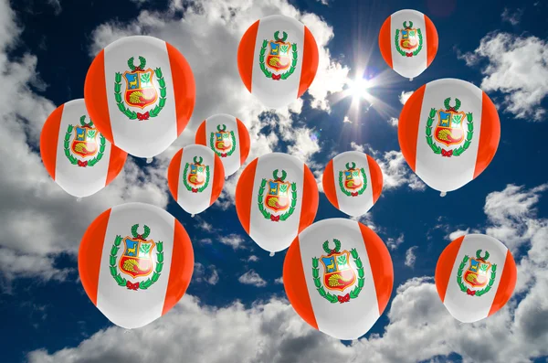 Many balloons with peru flag on sky — Stock Photo, Image