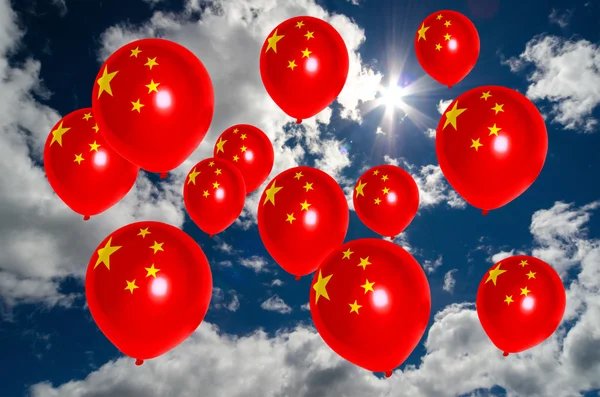 Muitos balões com bandeira da China no céu Imagens Royalty-Free