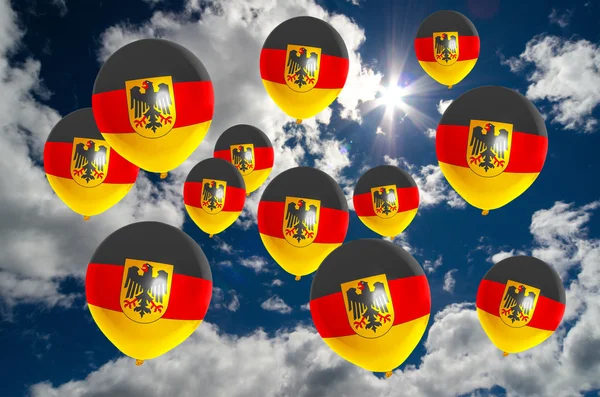 Muchos globos con bandera de Alemania en el cielo Fotos de stock