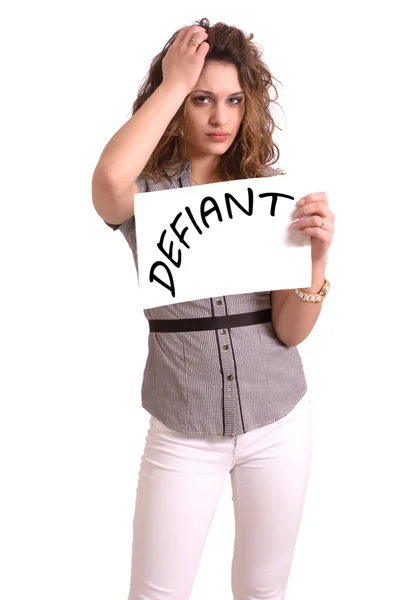 Uncomfortable woman holding paper with Defiant text — Stock Photo, Image