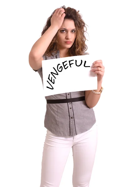 Uncomfortable woman holding paper with Vengeful text — Stock Photo, Image