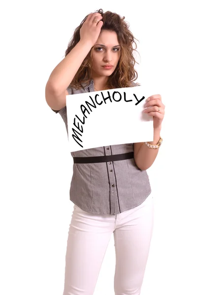 Uncomfortable woman holding paper with Melancholy text — Stock Photo, Image