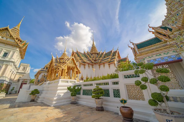 Golden pagoda at Temple of the Emerald Buddha in Bangkok, Thailand. Wat Phra Kaew and Grand palace in old town, urban city. Buddhist temple, Thai architecture. A tourist attraction