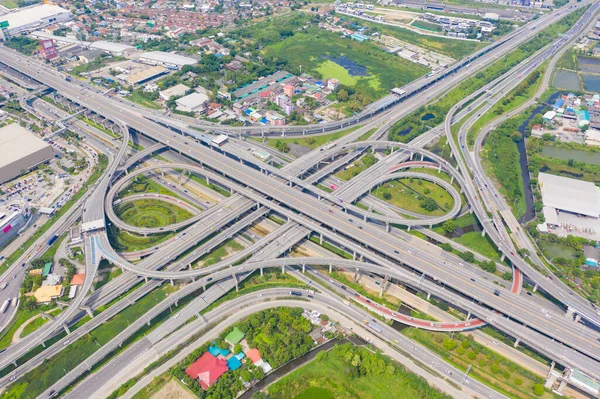 Aerial view of cars driving on highway junctions. Bridge street roads in connection network of architecture concept. Top view. Urban city, Bangkok, Thailand.