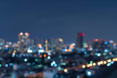 Bangkok, Tayland 'daki gökdelen binalarının soyut arkaplanı Bokeh, gece vakti bulanık fotoğraf. Şehir manzarası.