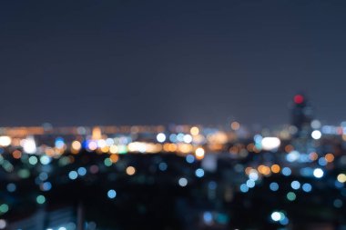 Bangkok, Tayland 'daki gökdelen binalarının soyut arkaplanı Bokeh, gece vakti bulanık fotoğraf. Şehir manzarası.
