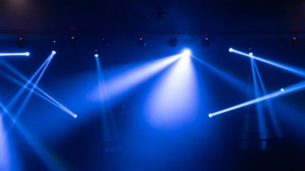 Empty stage concert with colorful lighting laser beam spotlight show in disco pub club bar background for party music dancing festival performance. Entertainment nightlife. Celebration event.