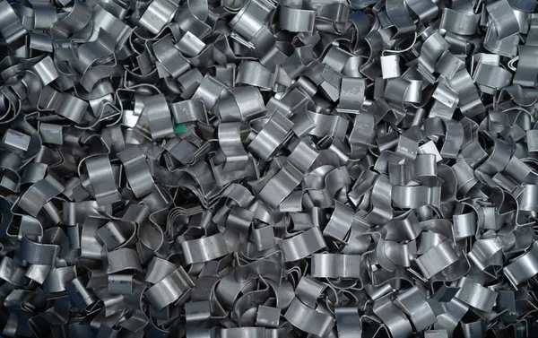 Part of stainless steel metal car seat accessories spare in industry factory store warehouse. Product supplies in engineering. Silver tool raw material. Reflection
