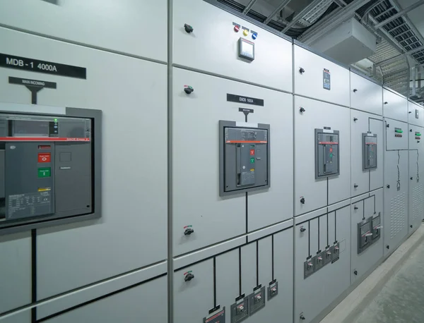 Interior of electrical room. Power energy motor machinery cabinets in control or server room, main operator station network and circuit center in industry factory manufacturing system. generator