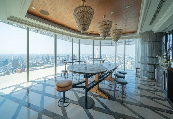 Inside of modern bar restaurant of hotel lobby, entrance and reception, waiting area with urban city view of outdoor, interior design decoration.