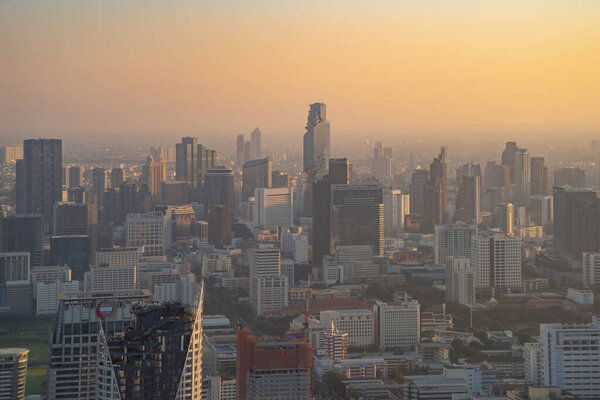 Aerial view of Bangkok Downtown Skyline, Thailand. Financial district and business centers in smart urban city in Asia. Skyscraper and high-rise buildings at sunset.