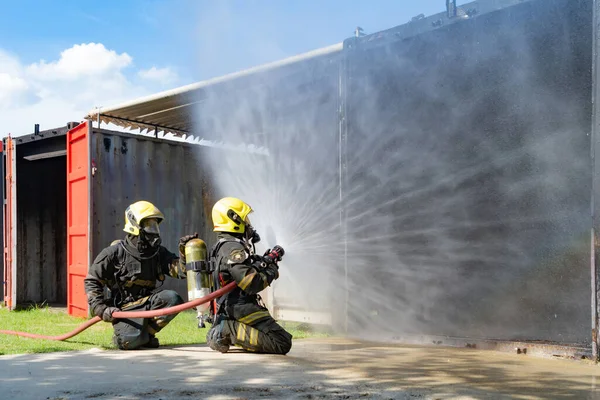 Group Firefighter Fireman Uniform Using Water Fire Hose Hot Burning — 图库照片