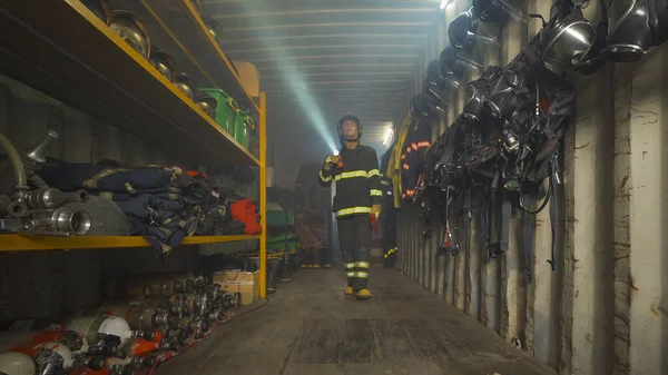 Caucasian Firefighter Fireman Uniform Inspecting Protection Gear Storage Safety Helmet — 스톡 사진