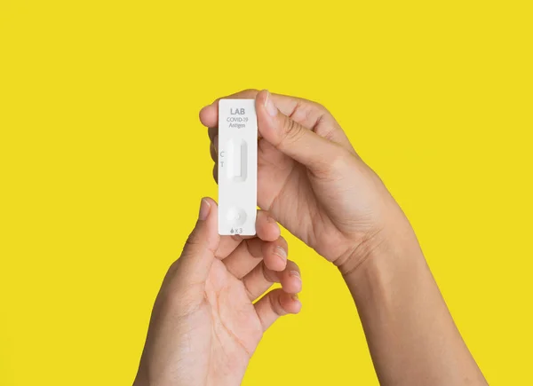 Hand Holds Test Swab Cartridge Isolated Yellow Covid Rapid Self — Fotografia de Stock