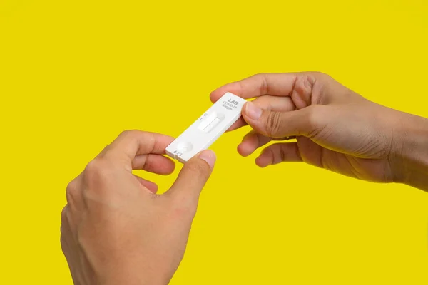 Hand Holds Test Swab Cartridge Isolated Yellow Covid Rapid Self — Fotografia de Stock