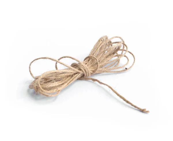 A Roll of natural fiber string on reflective background Stock