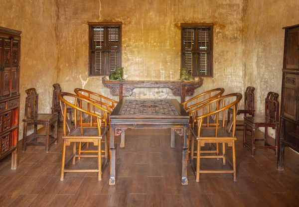 Traditional Chinese wooden meeting or dining room set up. Antique. Historic. Old. Interior architectural style.