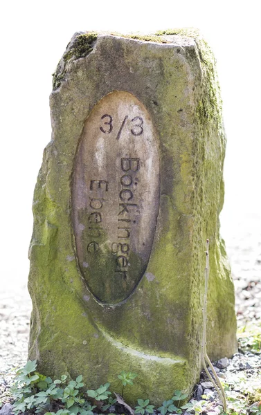 Old boundary stone in white background — Stock Photo, Image