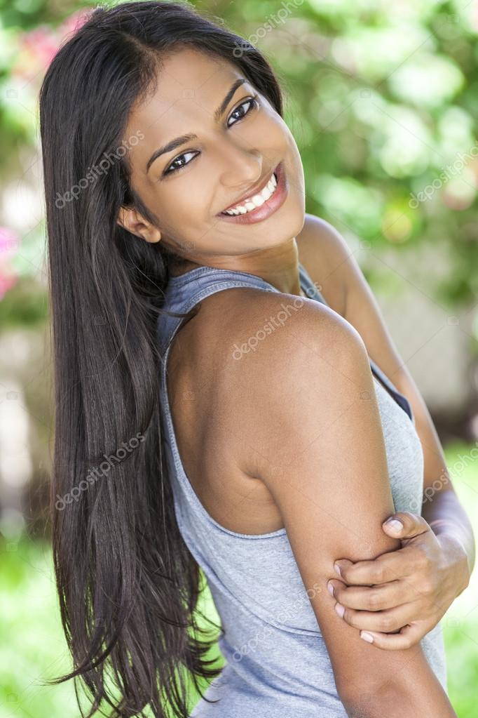 Smiling Indian Asian Young Woman Girl Stock Photo by ©dmbaker 82402584