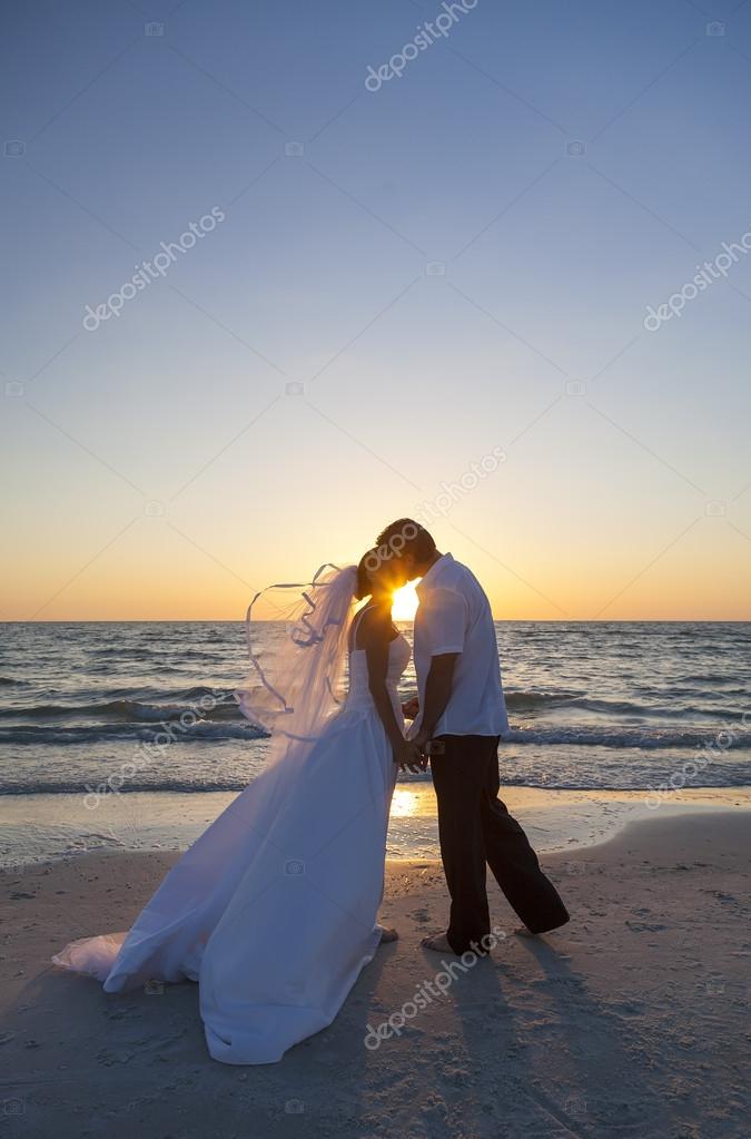 Bride And Groom Marriage Kissing Sunset Beach Wedding Stock