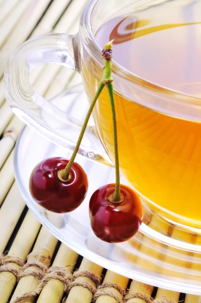 Tea with cherries. — Stock Photo, Image