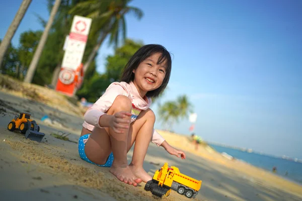 Single Asian Chinese Girl Playing Earth Mover Toys Beach Smiling — Stock Photo, Image