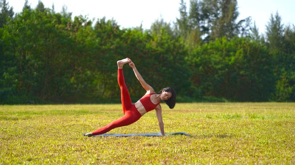 Asian Chinese Female Lady Yogi Practise Yoga Stretches Poses Park Stock Photo