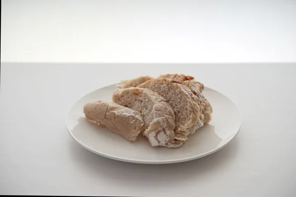 Bread served on white table — Stock Photo, Image