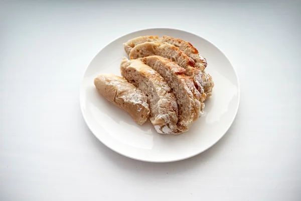 Bread served on white table — Stock Photo, Image