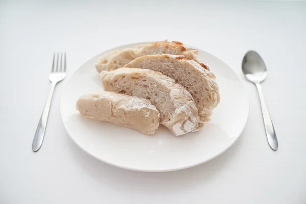 Bread served on white table — Stock Photo, Image