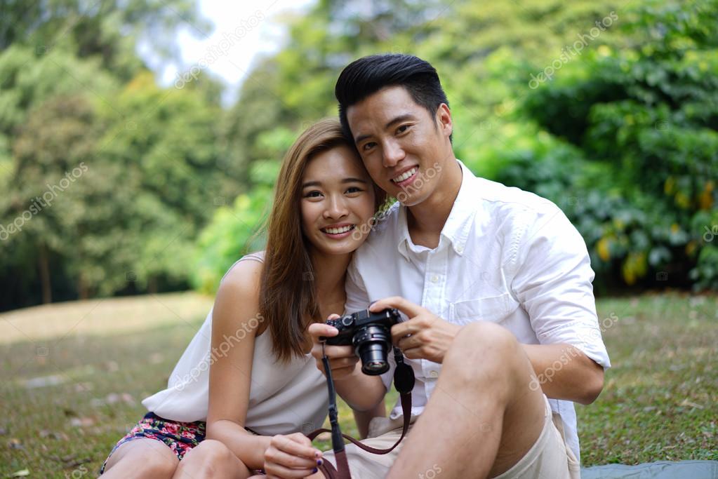 Watching outdoor couple asian