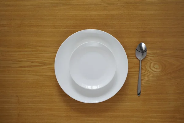 Empty set of plates from top view with spoon — Stock Photo, Image