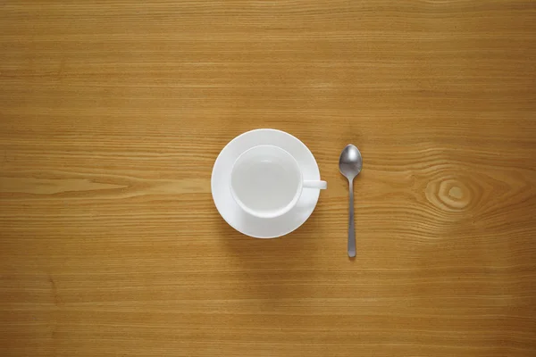 Empty tea cup from top view with a tea spoon — Stock Photo, Image