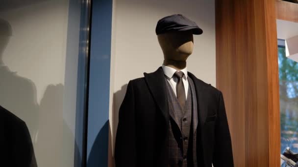 Mannequin with clothes from the new collection in the luxury boutique of mens suits — Stock Video