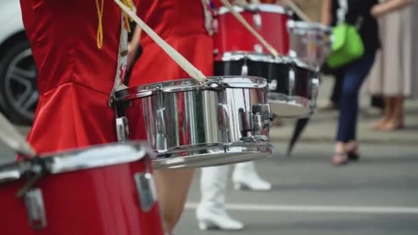 Young girls drummer in red vintage uniform at the parade. Street performance. Parade of majorettes — Stock Video