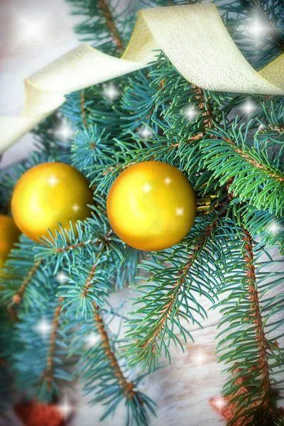 Golden bauble on Christmas tree — Stok fotoğraf