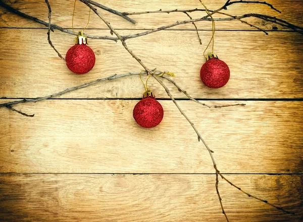 Red baubles on wooden background — Stock Photo, Image