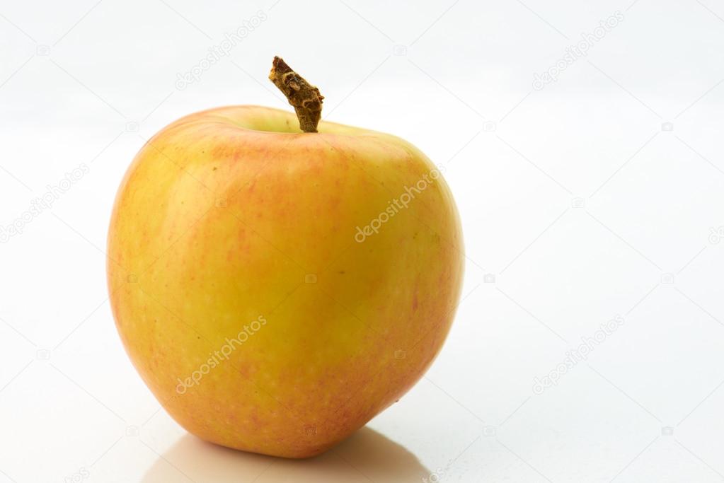 Yellow apple isolated on white