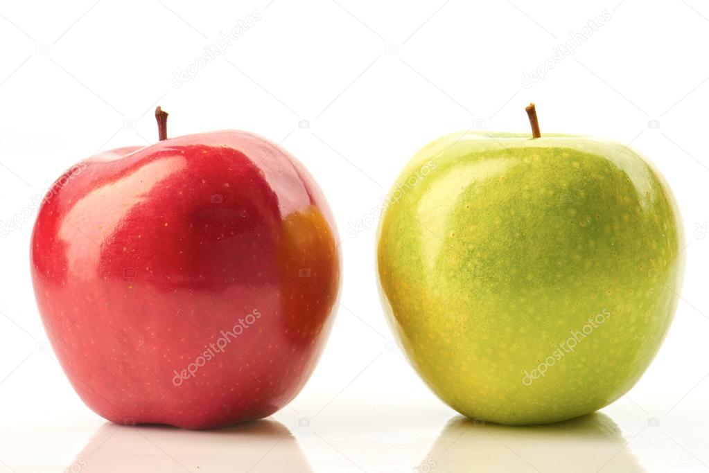 Red and green apples on white