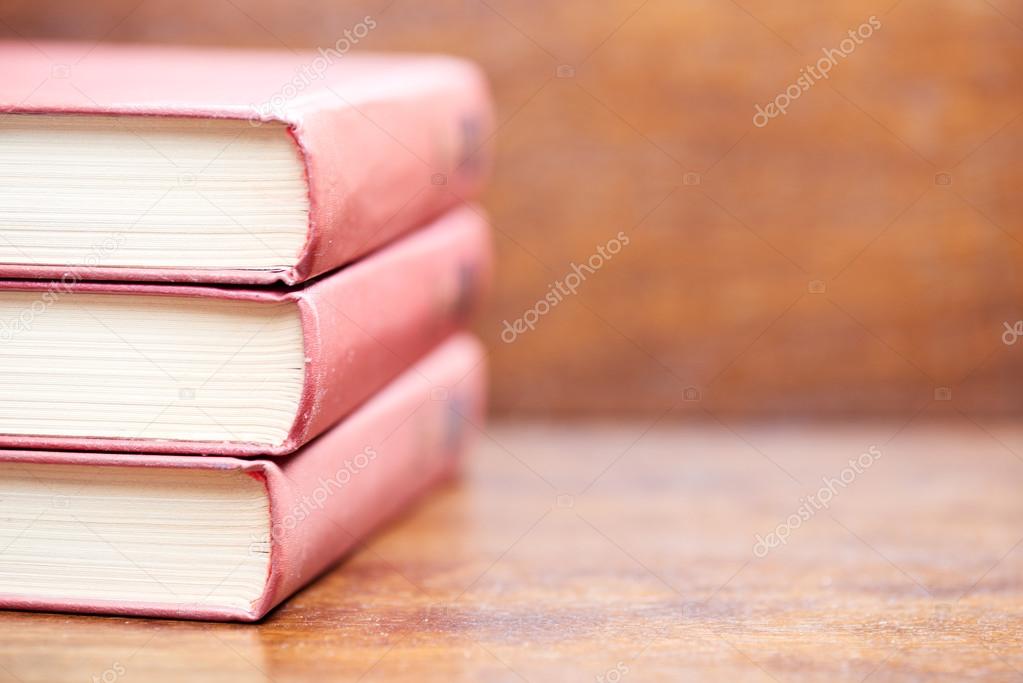 Three old books on the table