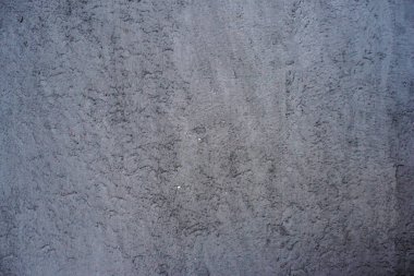 Dekoratif sıva arkaplanı, pürüzlü kenarlı pürüzlü kum, gri beyaz kirli renk.