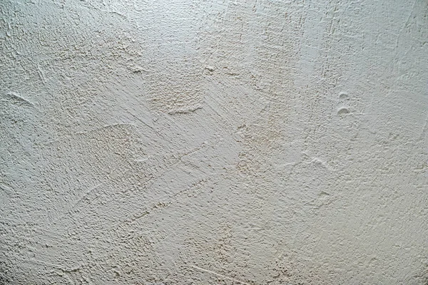 Decorative stucco background with textured sand with rough ragged edges gray white dirty color